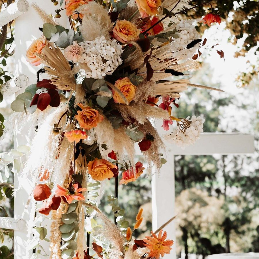 Hanging floral installation above a reception table